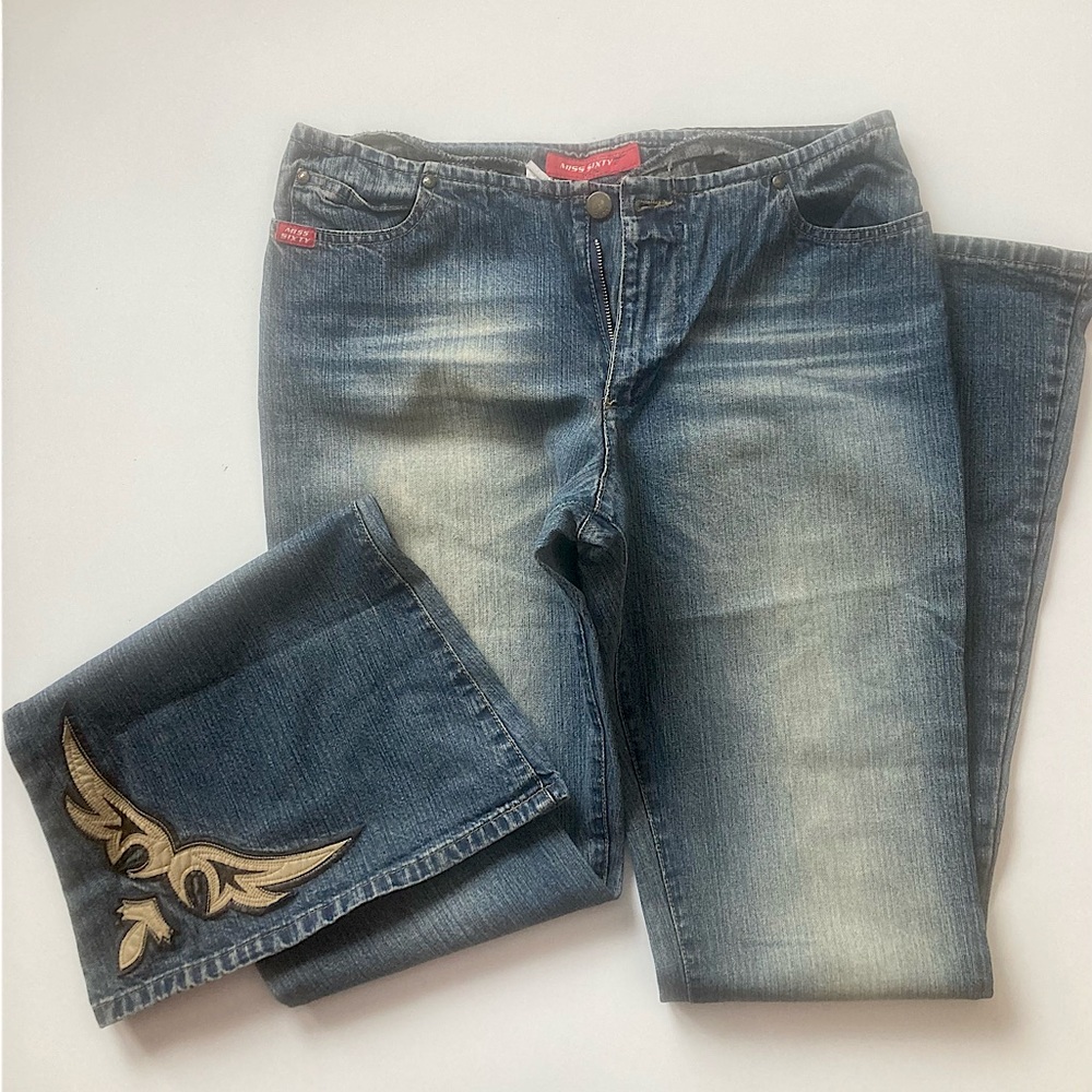Vintage jean with leather detail.
